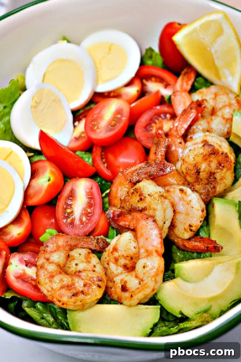 Customizing your Low-Carb Shrimp Louie Salad with fresh ingredients.