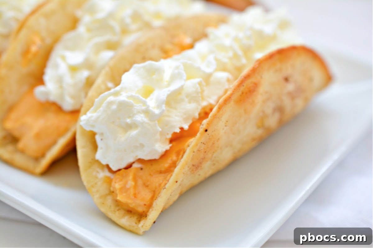Platter of Keto Pumpkin Pie Tacos, fully assembled and topped with whipped cream.