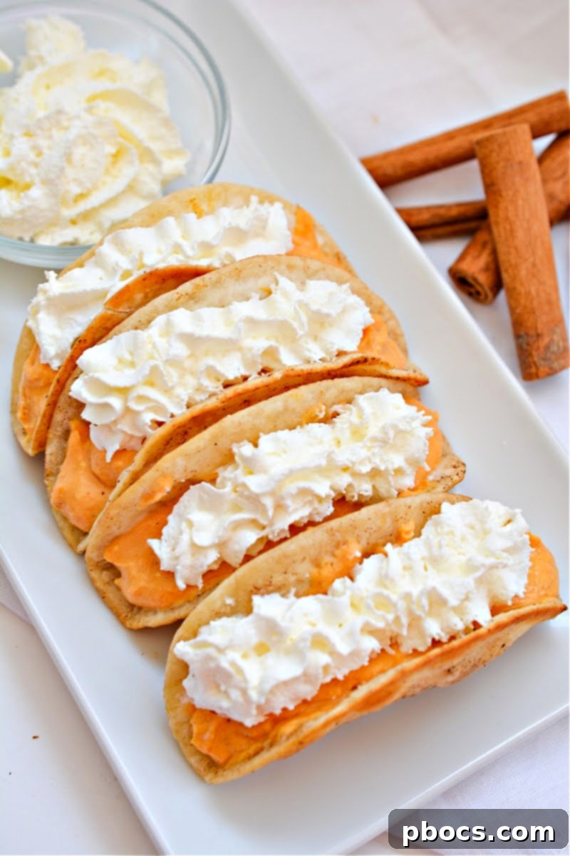 Several Keto Pumpkin Pie Tacos arranged artfully on a serving platter, ready for guests.