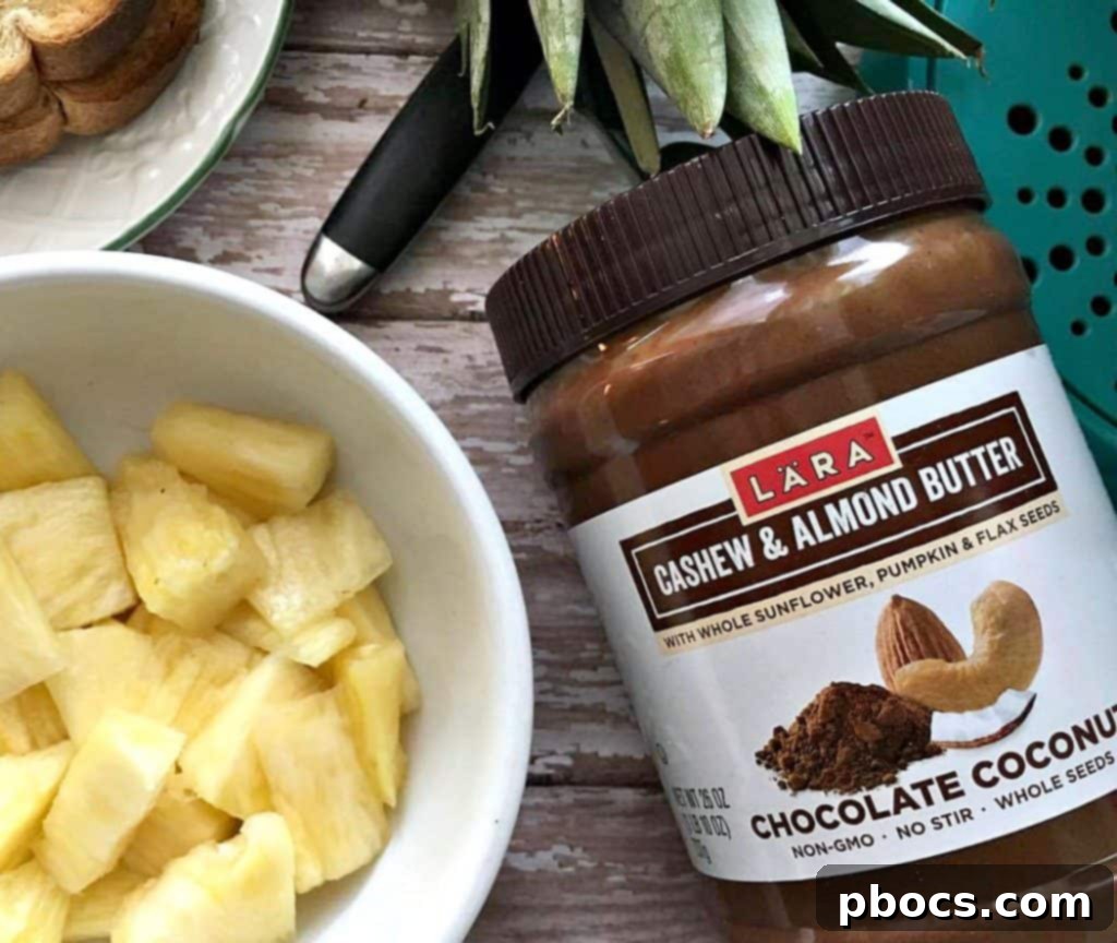 Fresh pineapple being sliced into small chunks for Chocolate Coconut & Pineapple Toast