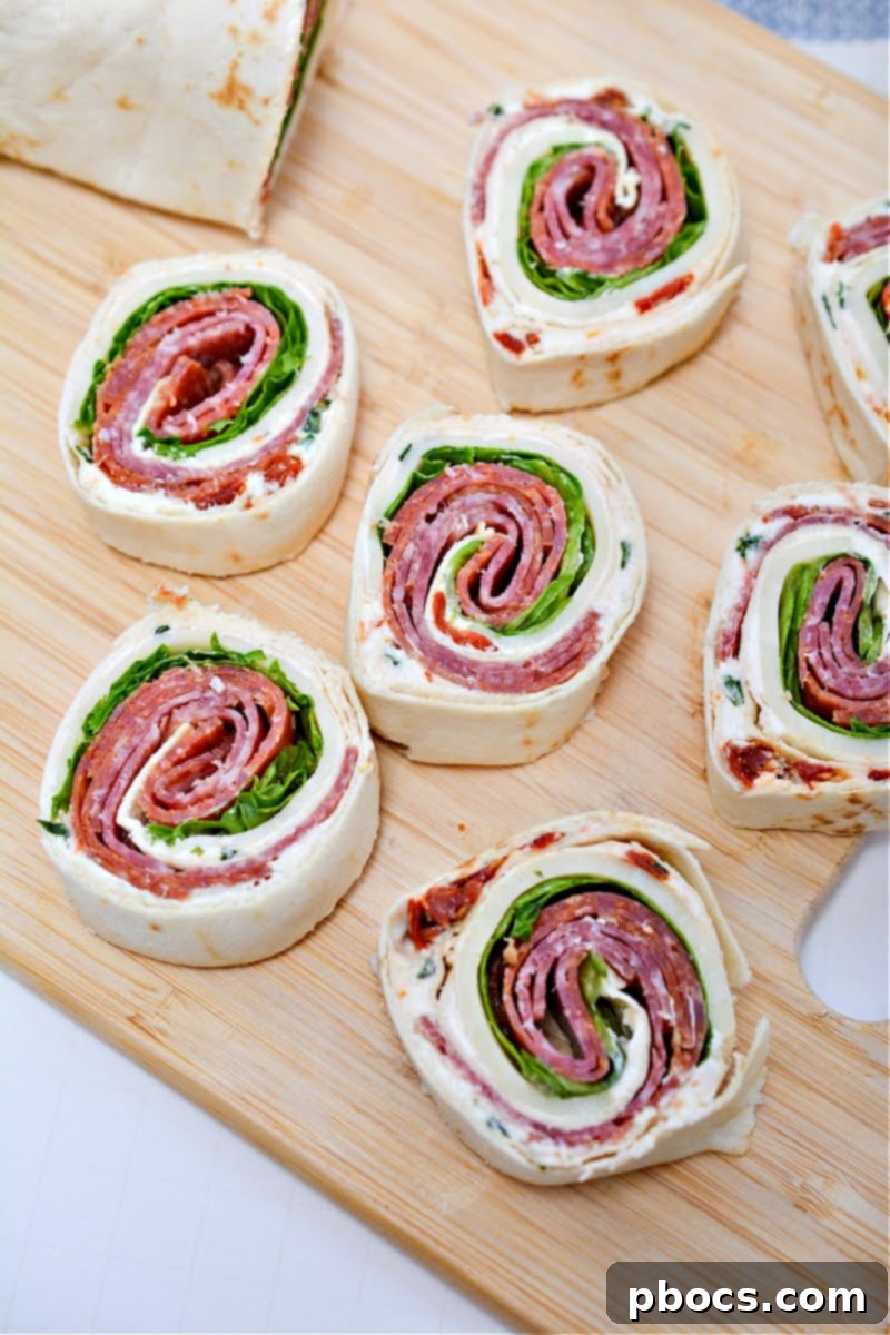 Keto Italian Swirls 4 A close-up shot of the fresh ingredients for Keto Italian Pinwheels, including basil, sun-dried tomatoes, and cream cheese.