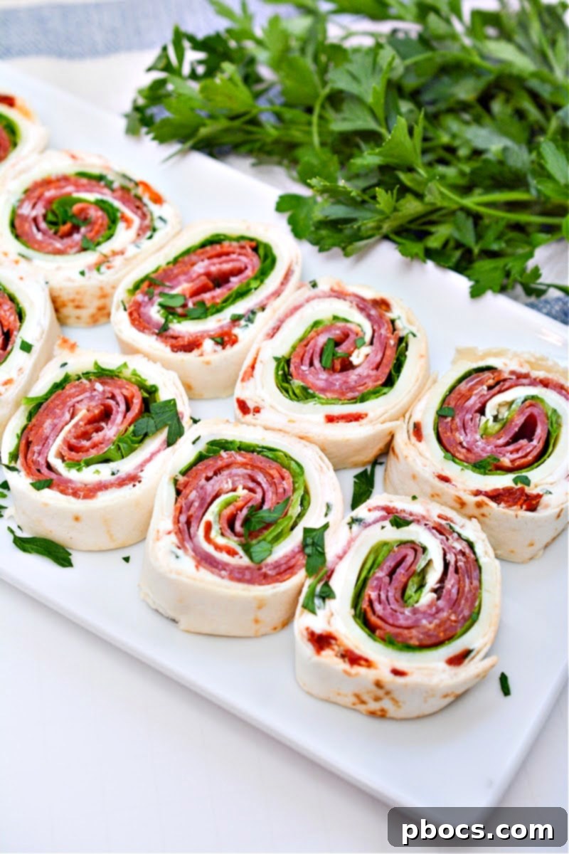 Keto Italian Swirls 6 A variety of ingredients including keto tortillas, cream cheese, and vegetables for the pinwheels.