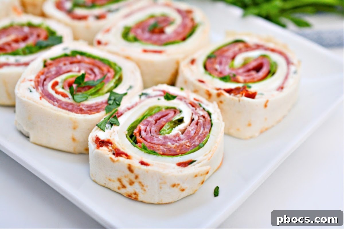 Keto Italian Swirls 7 Sliced Keto Italian Pinwheels arranged on a serving plate.