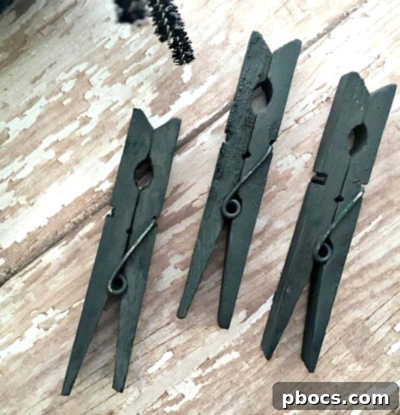 Gluing pom pom decorations onto clothespins