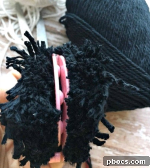 Securely tying the pom pom core