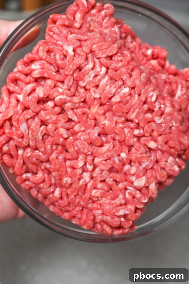 Browning ground beef, onion, and turnips in a pot