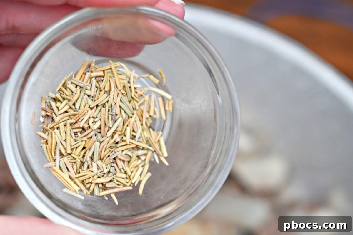 Stirring tomato paste, garlic, and herbs into the browned meat and vegetables