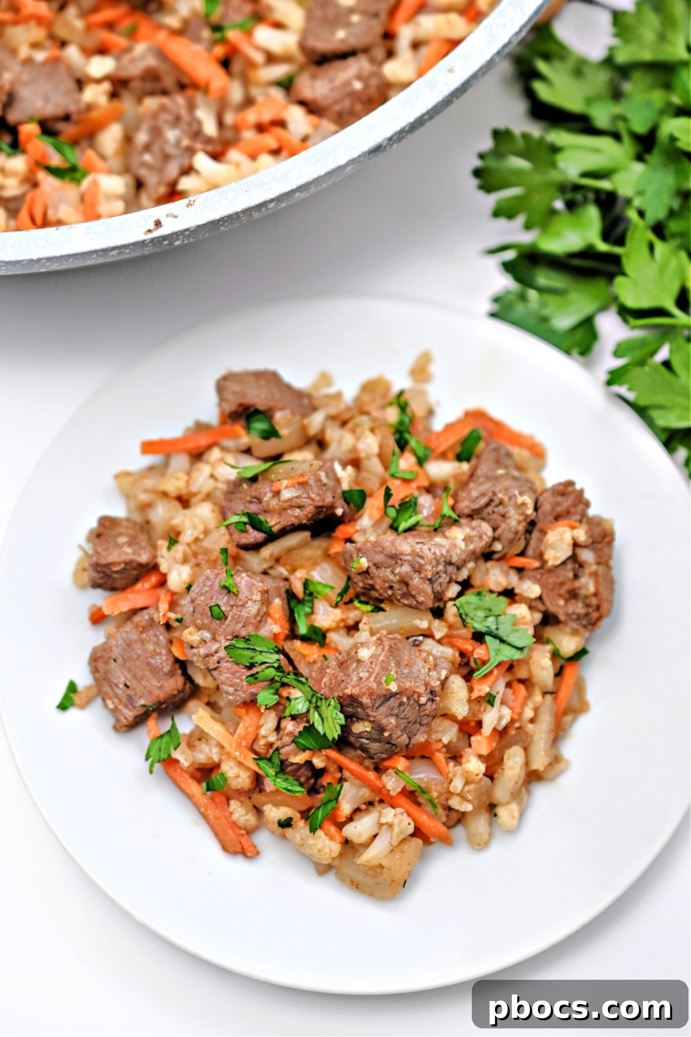 Close-up of Low-Carb Beef Cauliflower Rice Pilaf, showcasing its rich texture and ingredients