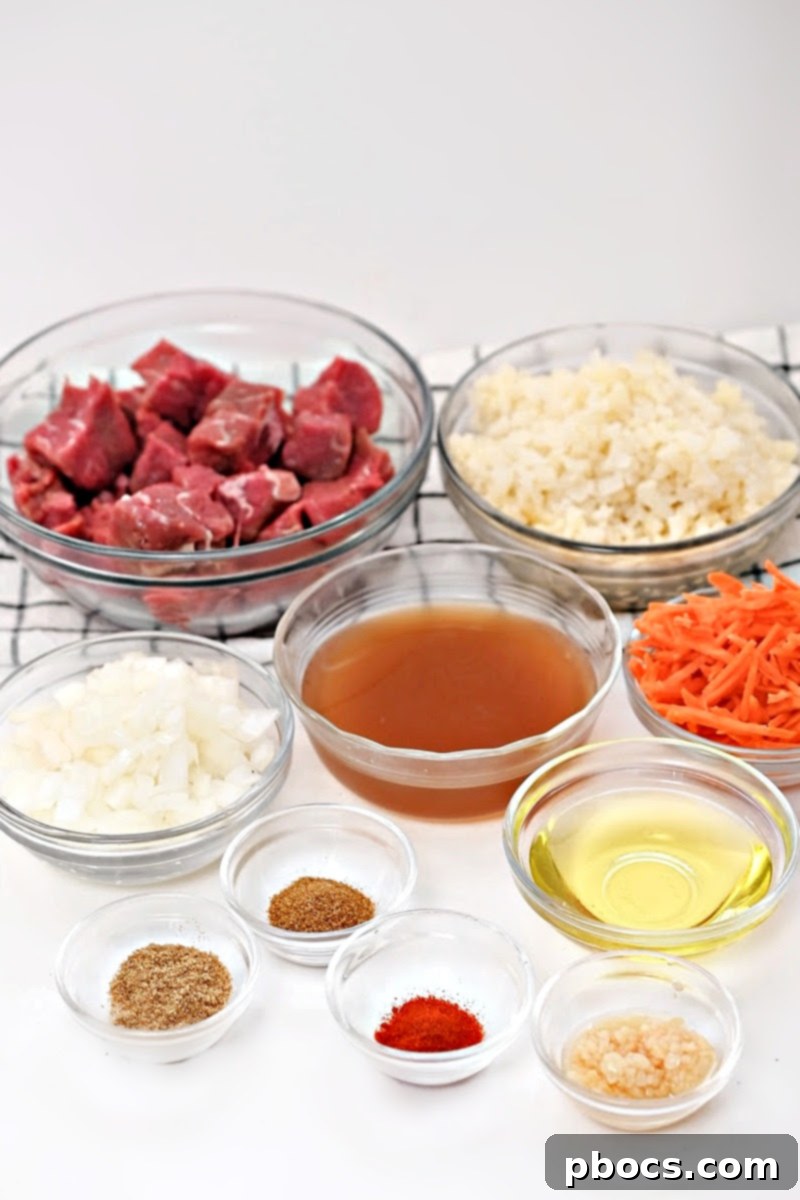 Ingredients for Low-Carb Beef Cauliflower Rice Pilaf laid out on a table