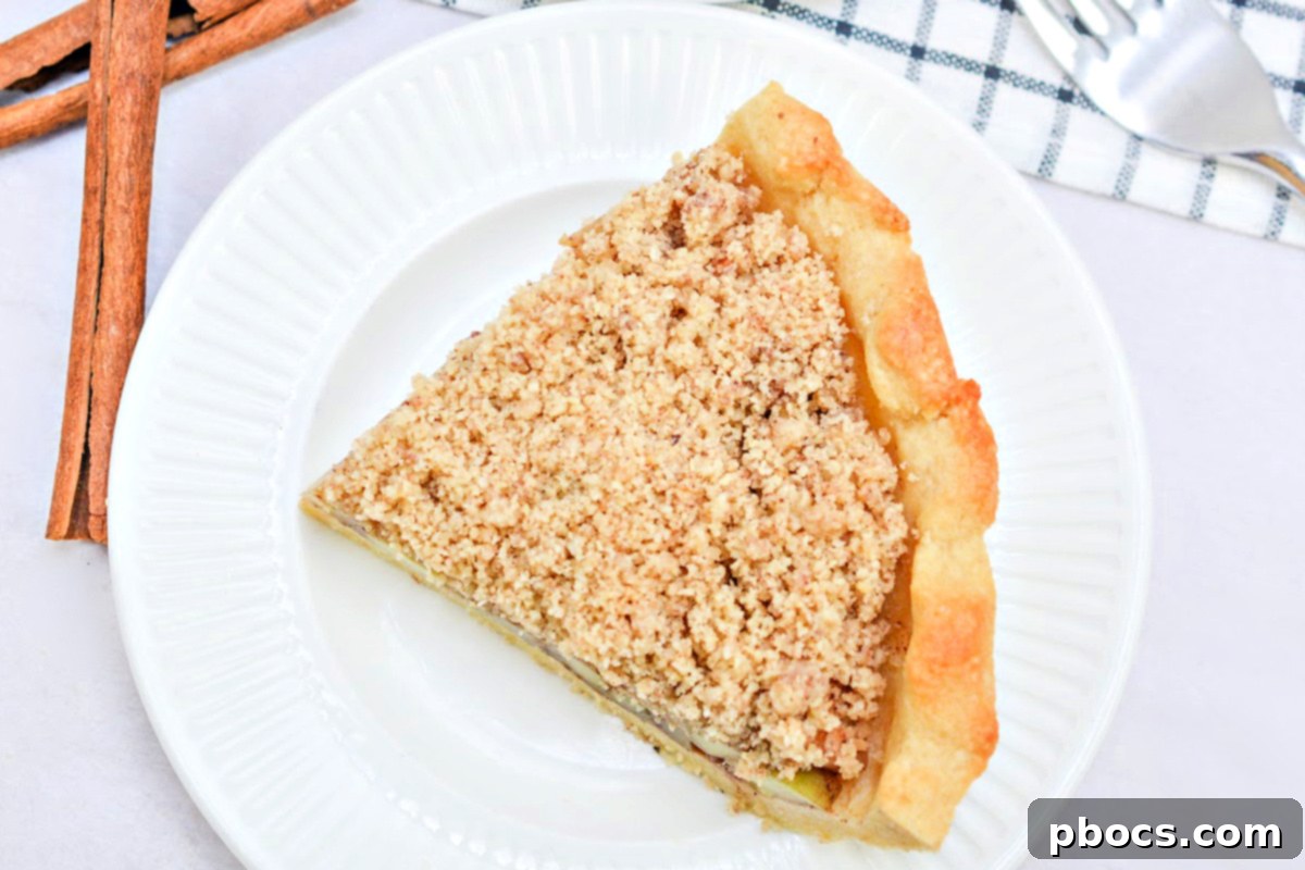 A whole Keto Apple Pie, carefully wrapped and ready for storage, in a freezer-safe pie plate.