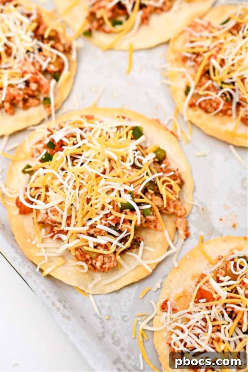 Crispy Keto Tostadas 13 Adding shredded cheese to chicken keto tostadas