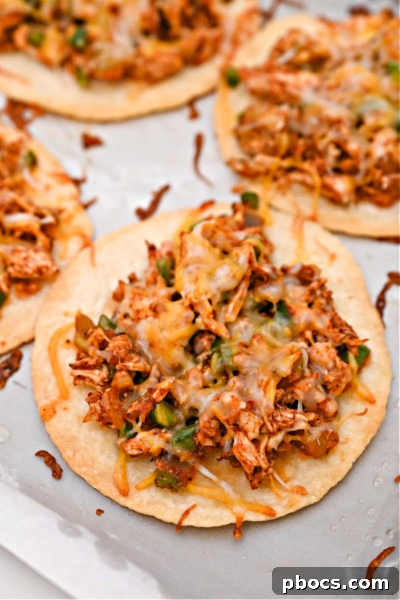 Crispy Keto Tostadas 14 Keto tostadas with just chicken and melted cheese on it