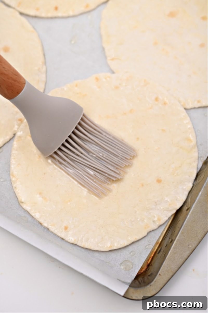 Crispy Keto Tostadas 10 Brushing keto tortillas with olive oil