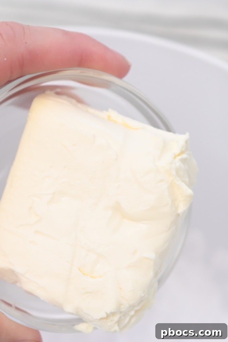 Softened cream cheese, a key ingredient for the delicious keto icing, ready for mixing.