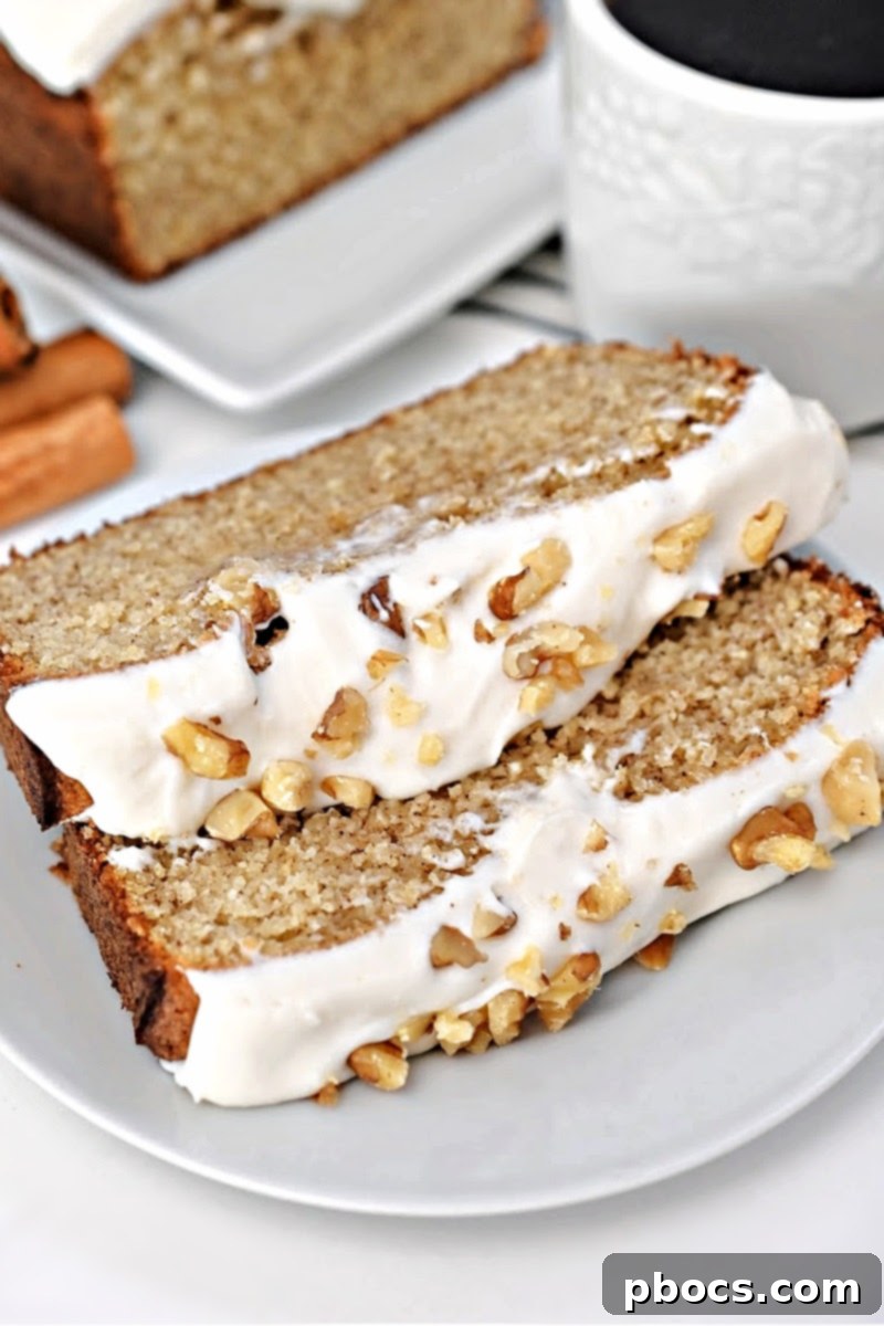 Two perfect slices of Keto Starbucks Gingerbread Loaf, showcasing the moist interior and creamy frosting.
