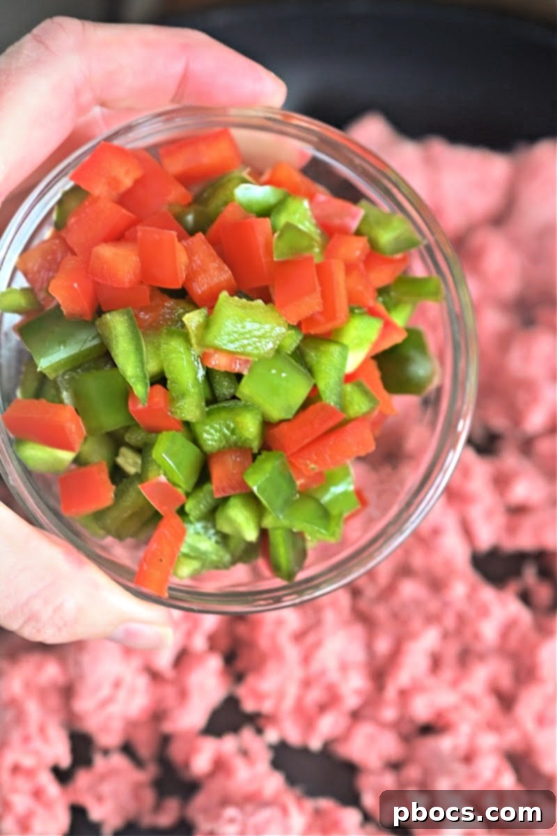 Sautéing ground beef, onions, and peppers