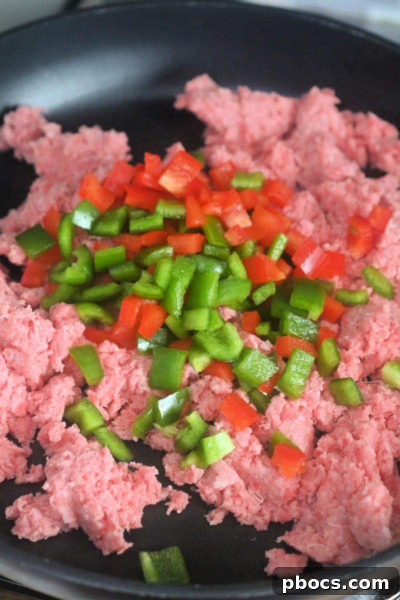 Browning beef and softening vegetables for chili mac