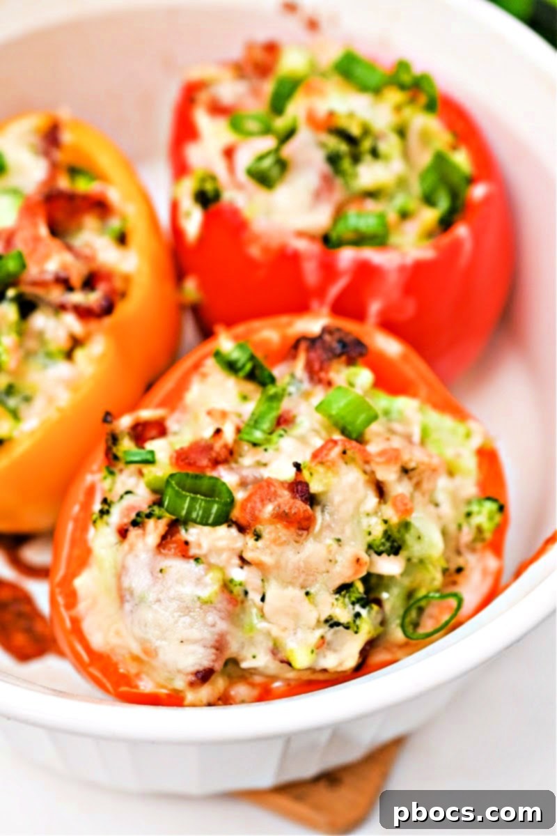 Baked Keto Ranch Chicken and Broccoli Stuffed Peppers topped with melted cheese