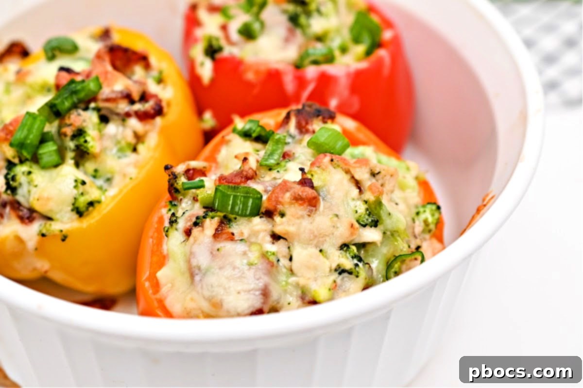 Keto Ranch Chicken and Broccoli Stuffed Peppers served with a side dish