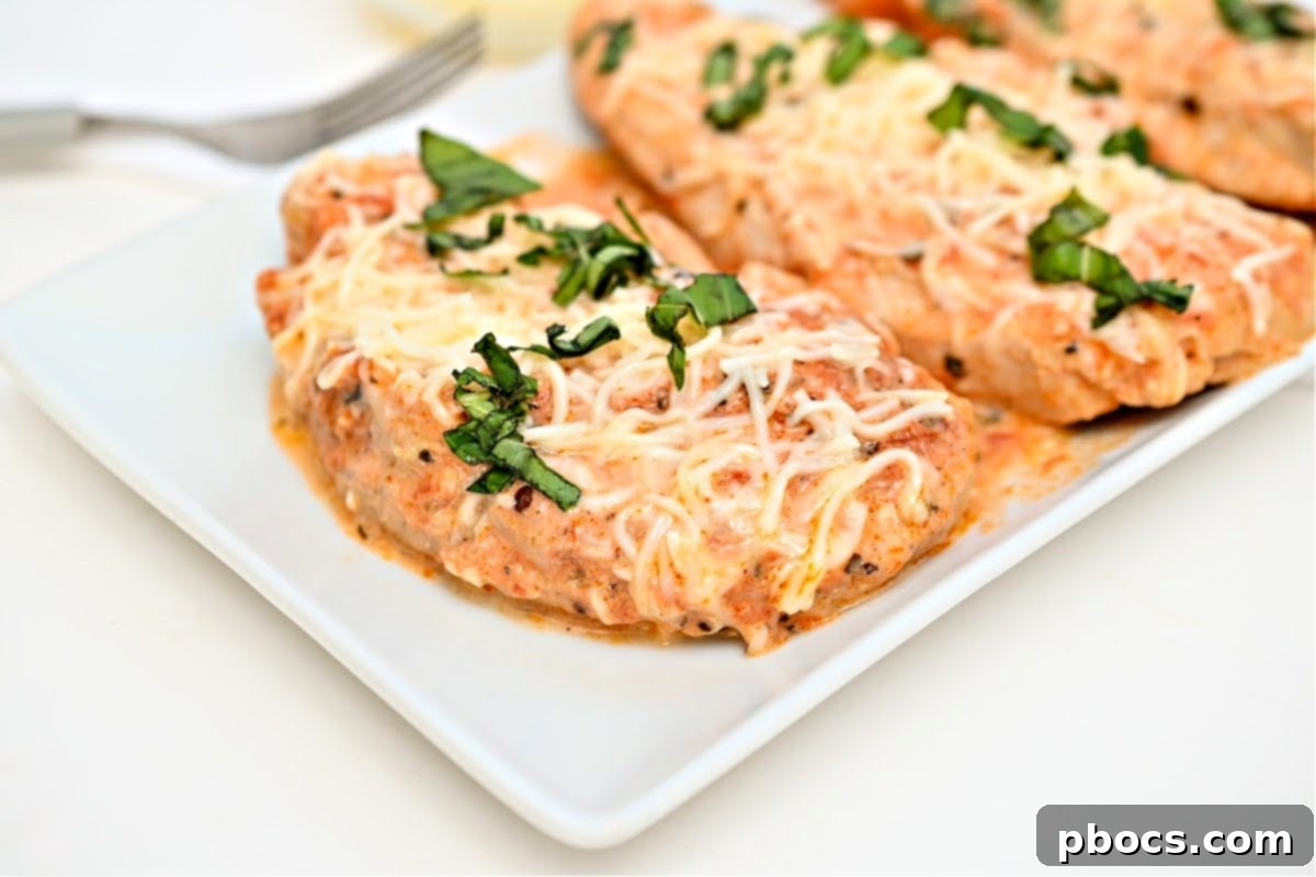 Keto Crockpot Tomato Alfredo Chicken, stored in airtight containers.