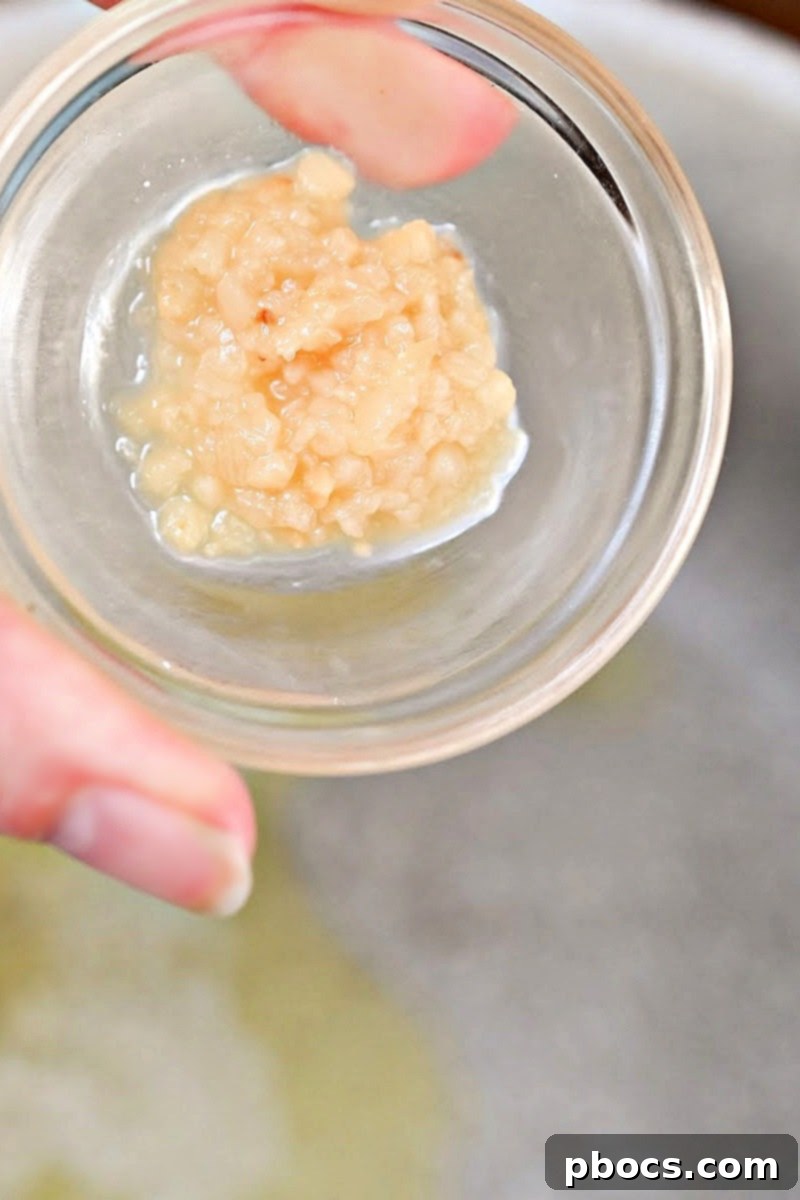 Keto Crockpot Tomato Alfredo Chicken, slow cooking.