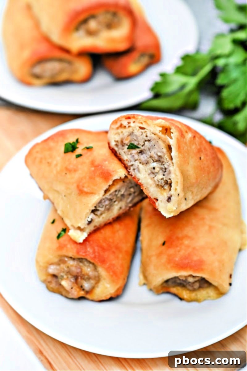Uncooked Keto Sausage Rolls on a baking sheet, ready for oven