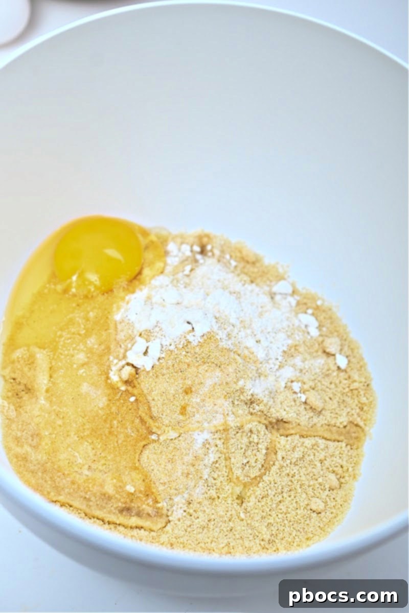 Garlic added to sautéed onions in a skillet