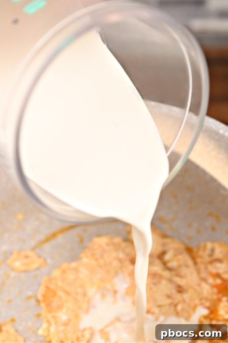Cream cheese and spices melting into the sauce for casserole
