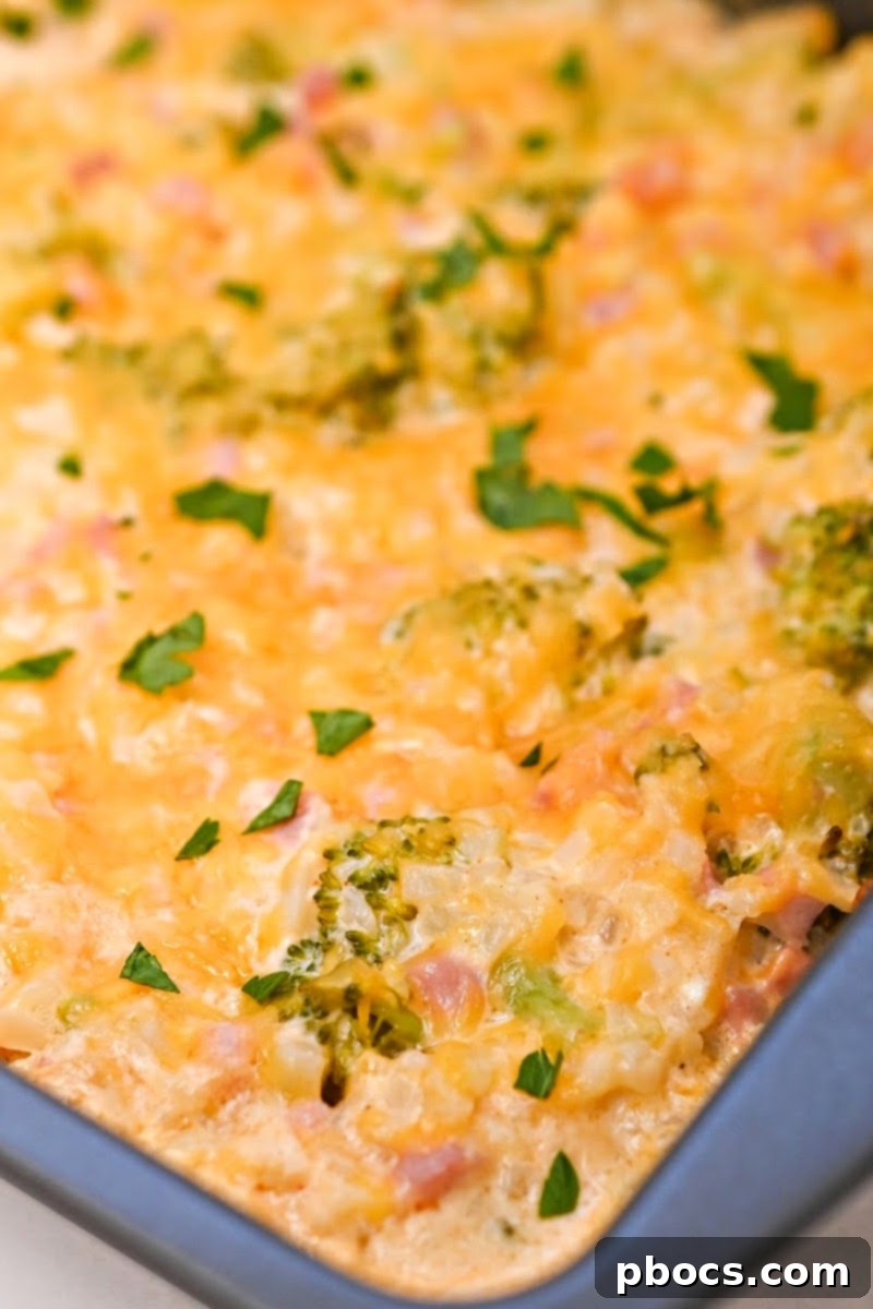 Sprinkling cheese on top of the casserole before baking