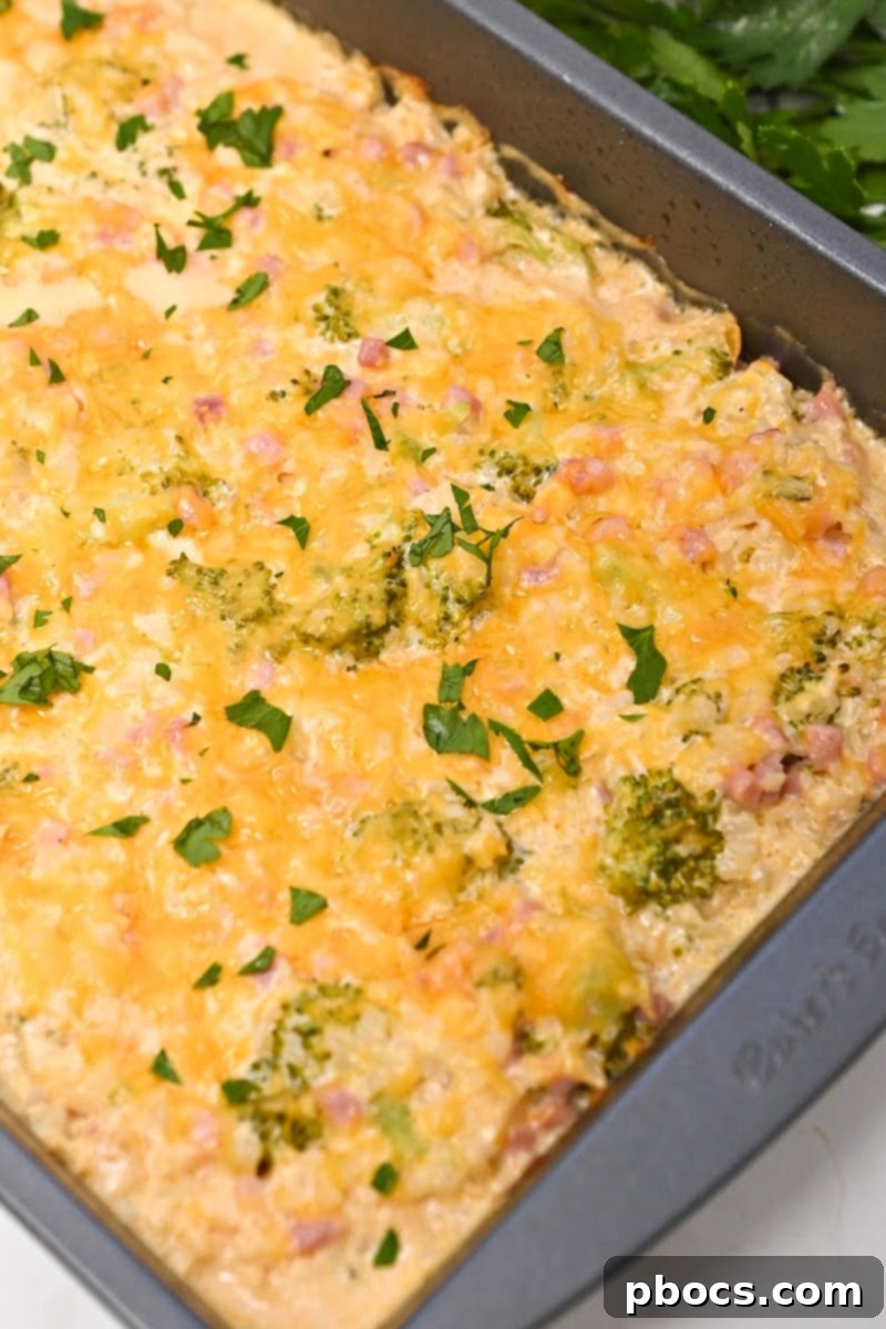 Serving of Cheesy Low-Carb Broccoli Rice Casserole With Ham