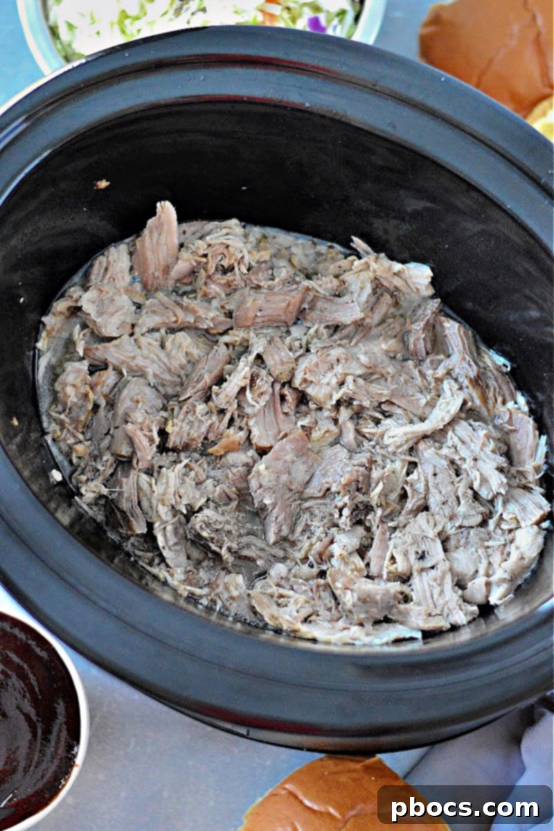 Step 5: Shredding the cooked pork with two forks