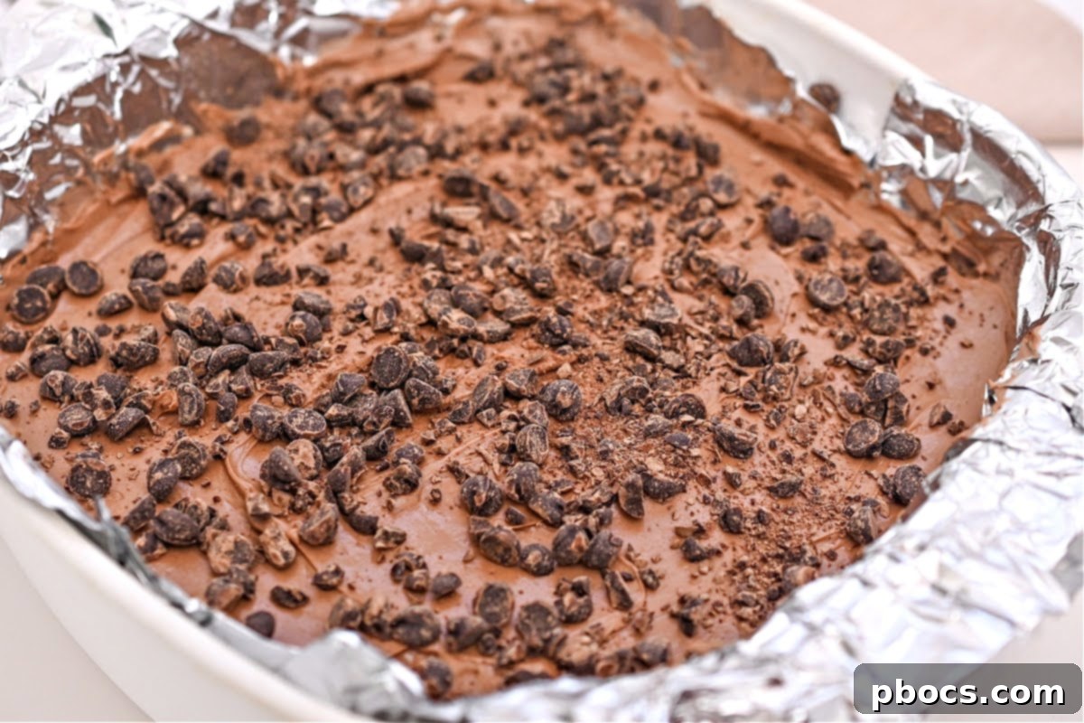 Keto No-Bake Death By Chocolate Cheesecake Bars 12 Mixing cheesecake filling ingredients