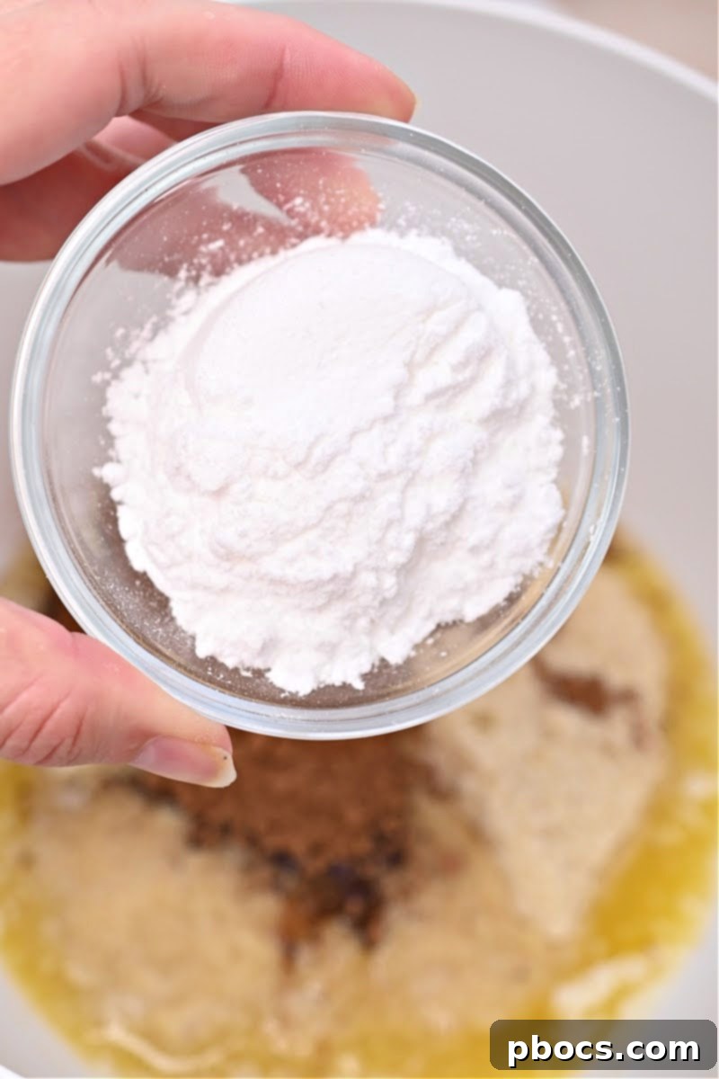 Keto No-Bake Death By Chocolate Cheesecake Bars 8 Mixing ingredients for the keto chocolate crust