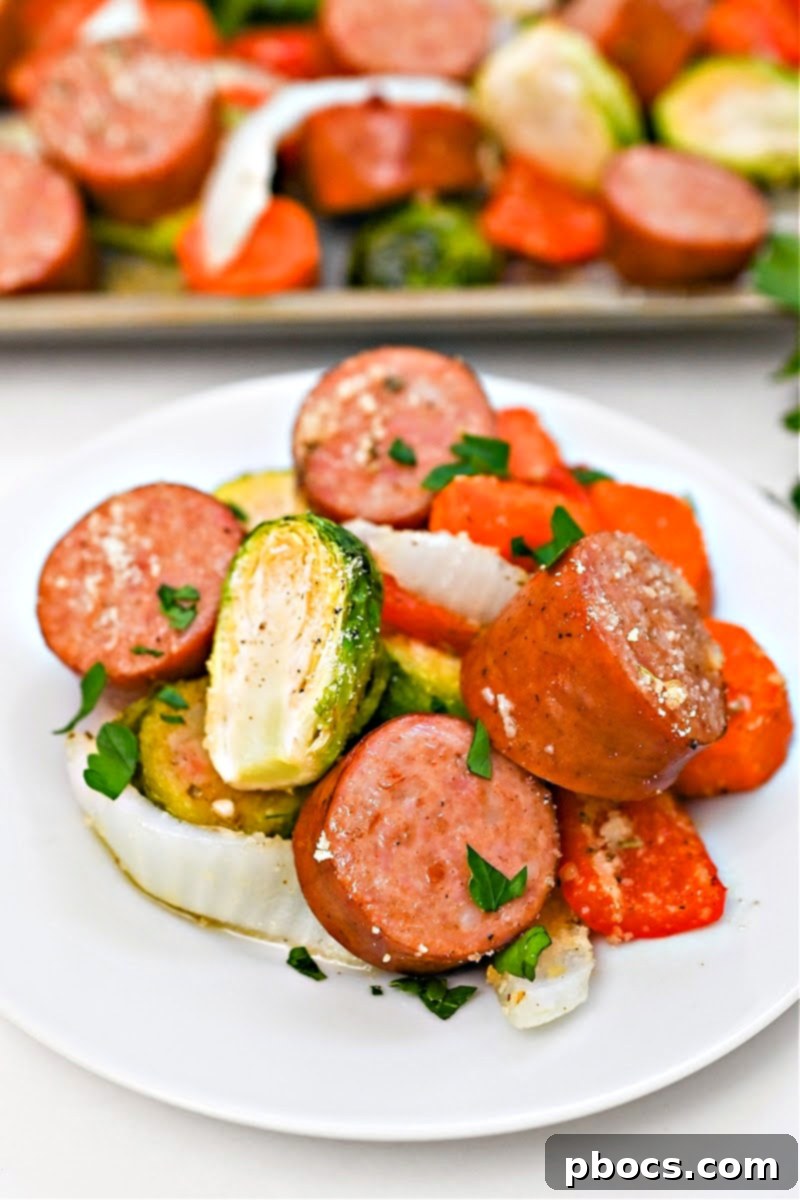 A sheet pan filled with Low Carb Honey Garlic Sausage and Veggies, showcasing the abundance and simplicity of the meal.