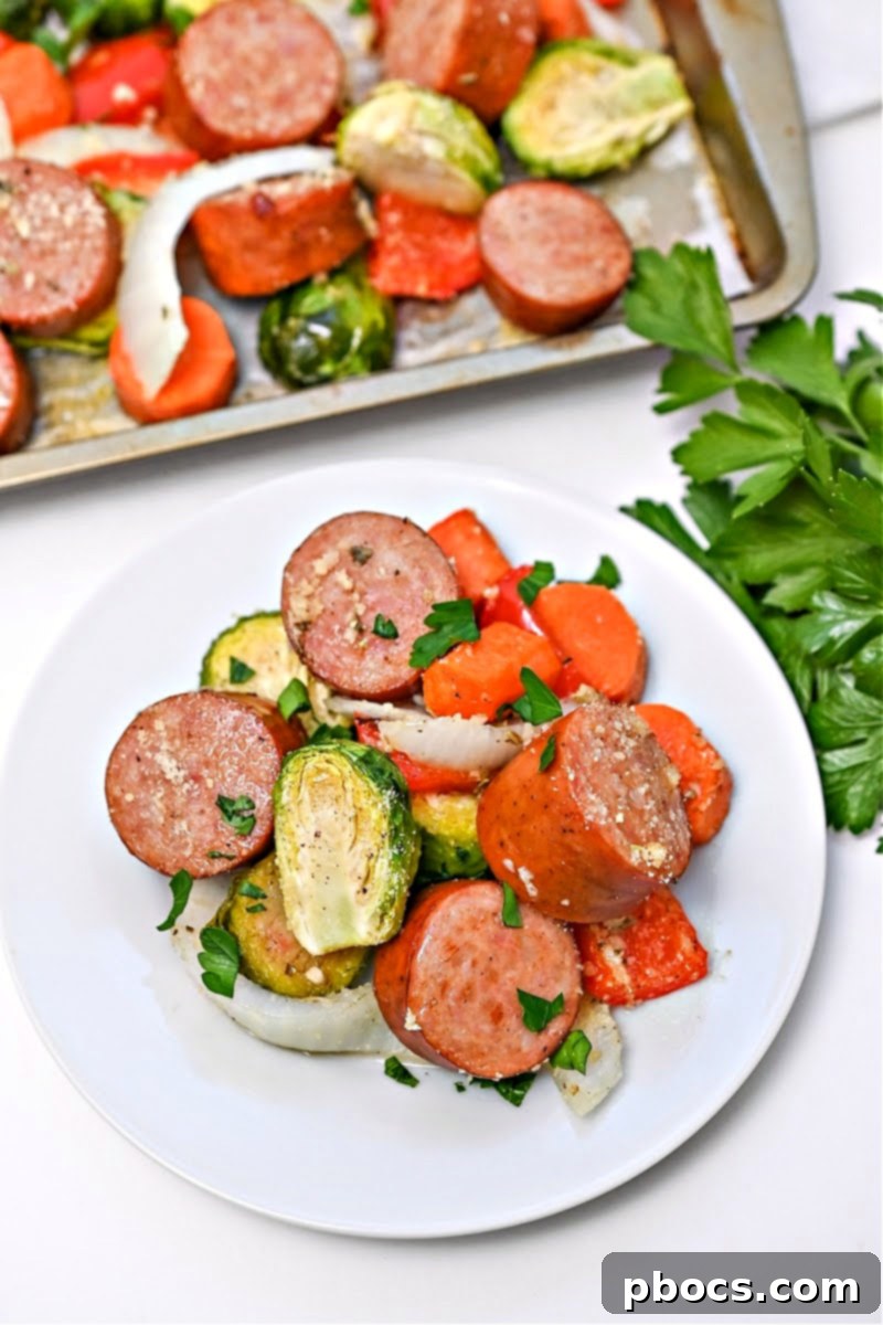 A serving of Low Carb Honey Garlic Sausage and Veggies on a pristine white plate, ready to be enjoyed.