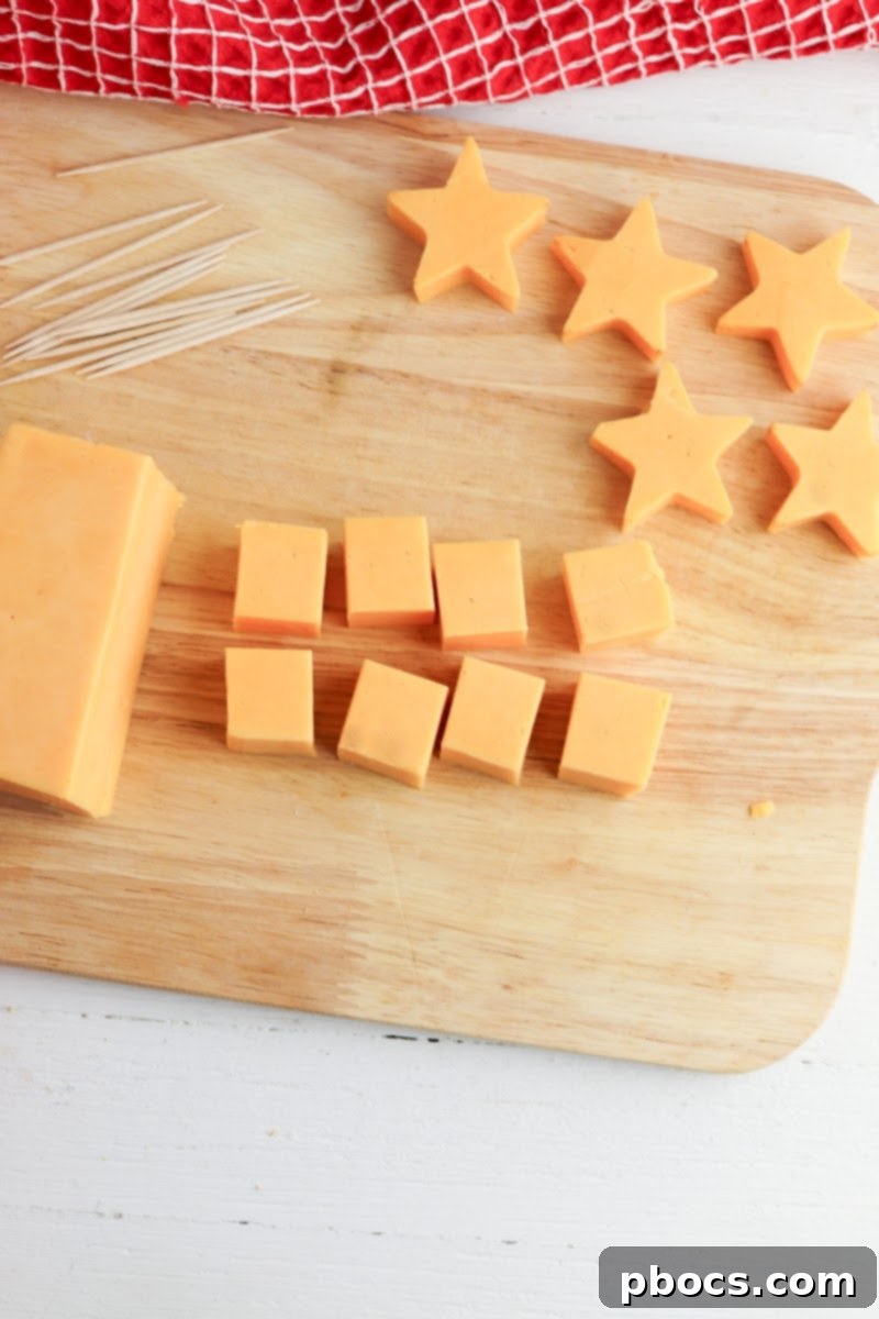 Keto Christmas Charcuterie Trees 10 Cutting Cheddar Cheese into cubes and stars for Christmas Trees