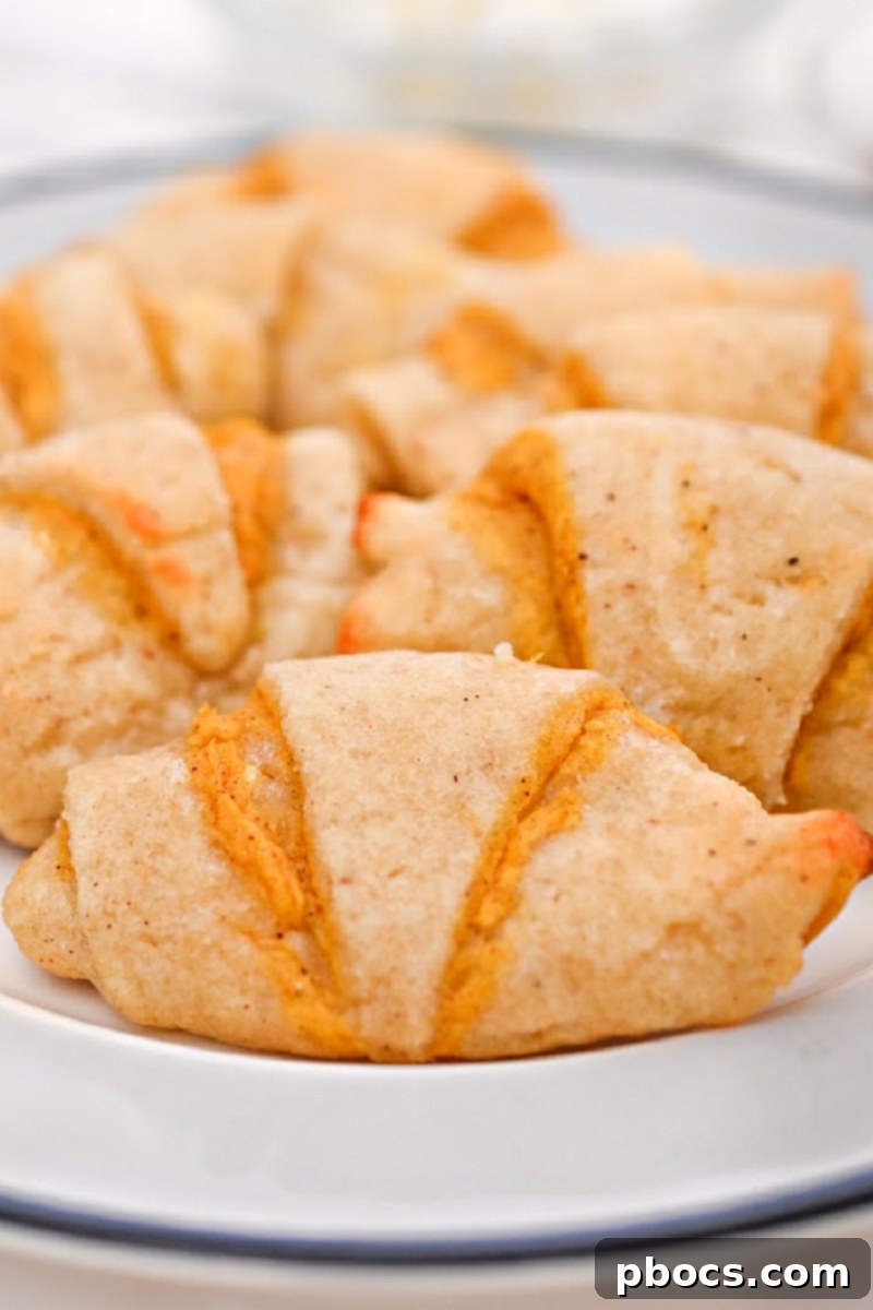 Rich pumpkin cream cheese filling inside golden keto crescent rolls, a perfect blend of sweet and savory.