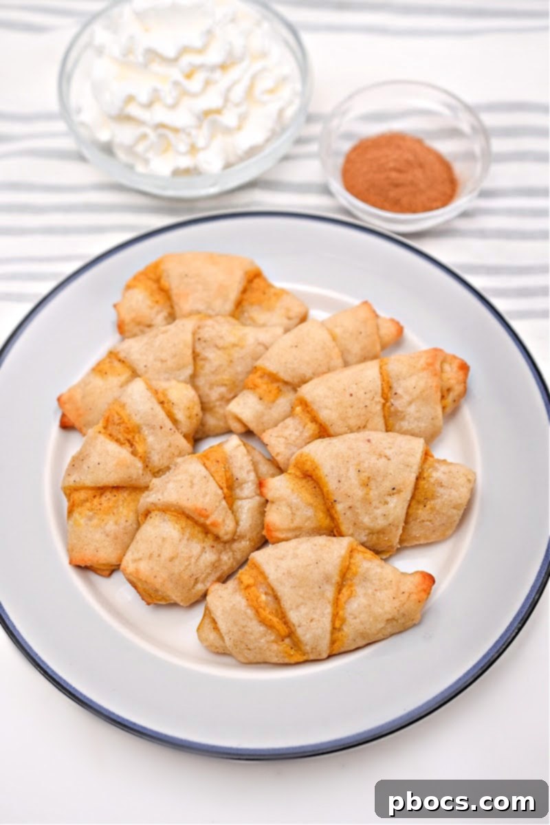 A festive spread of keto Thanksgiving side dishes, including golden pumpkin crescent rolls, ready for the holiday table.