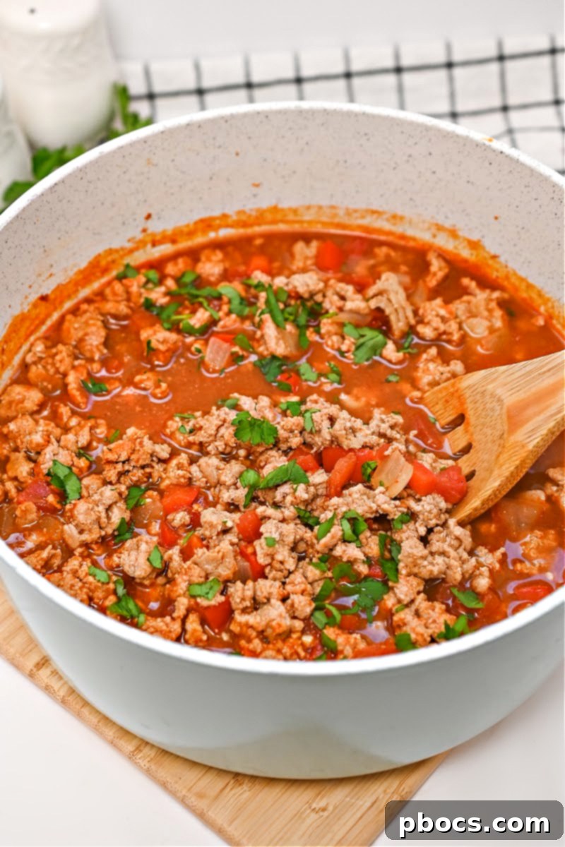 Close-up of a serving of Keto Pumpkin Chili, showcasing its rich texture