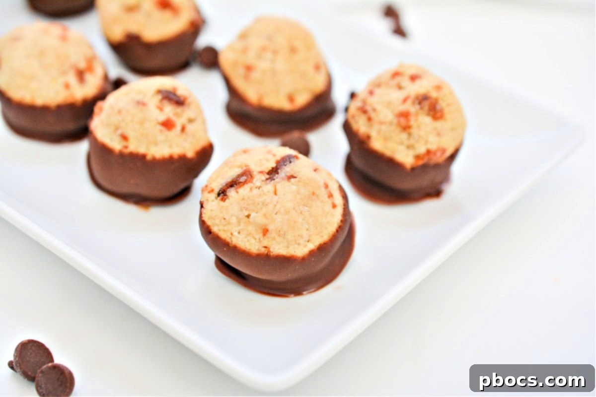 Finished Keto Maple Bacon Bites chilling on parchment paper, allowing the chocolate to set completely.