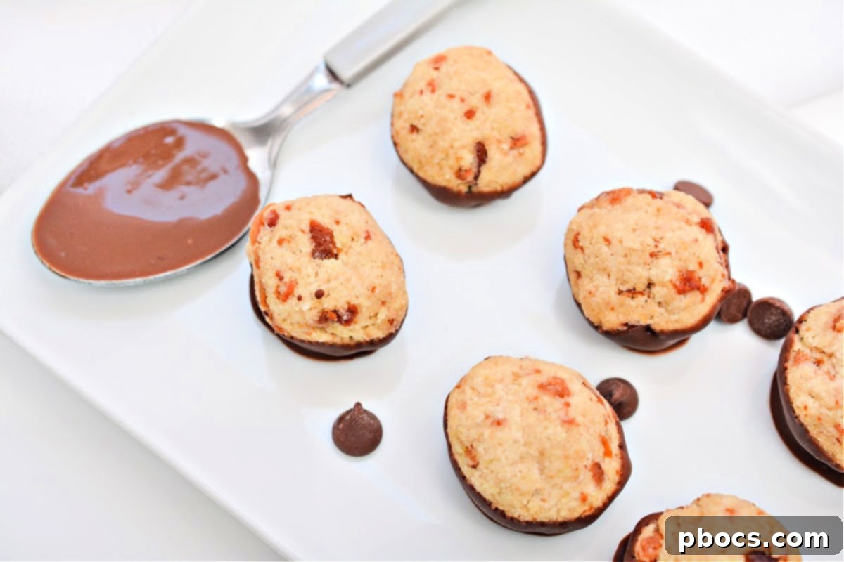 Several Keto Maple Bacon Bites artfully arranged on a white background, highlighting their rich texture.