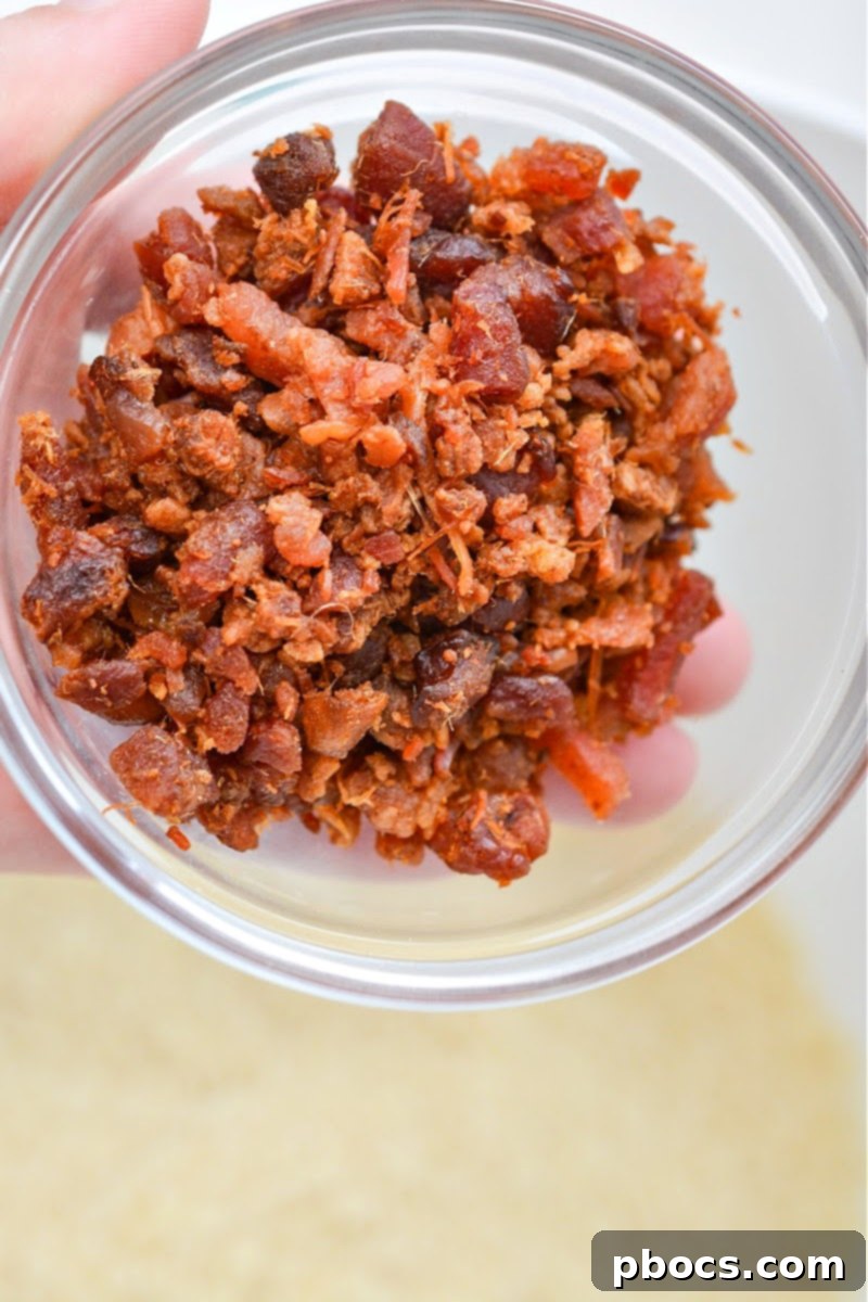Finely crumbled crispy bacon, ready to be added to the mixture.