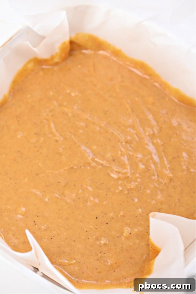 Pumpkin fudge mixture before setting, showing its smooth consistency