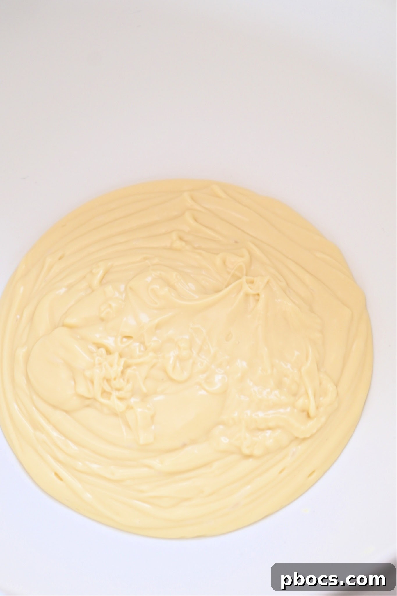 Melted Keto White Chocolate Chips in a bowl