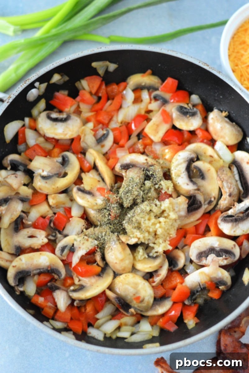 Sauteeing the veggies and spices in a skillet