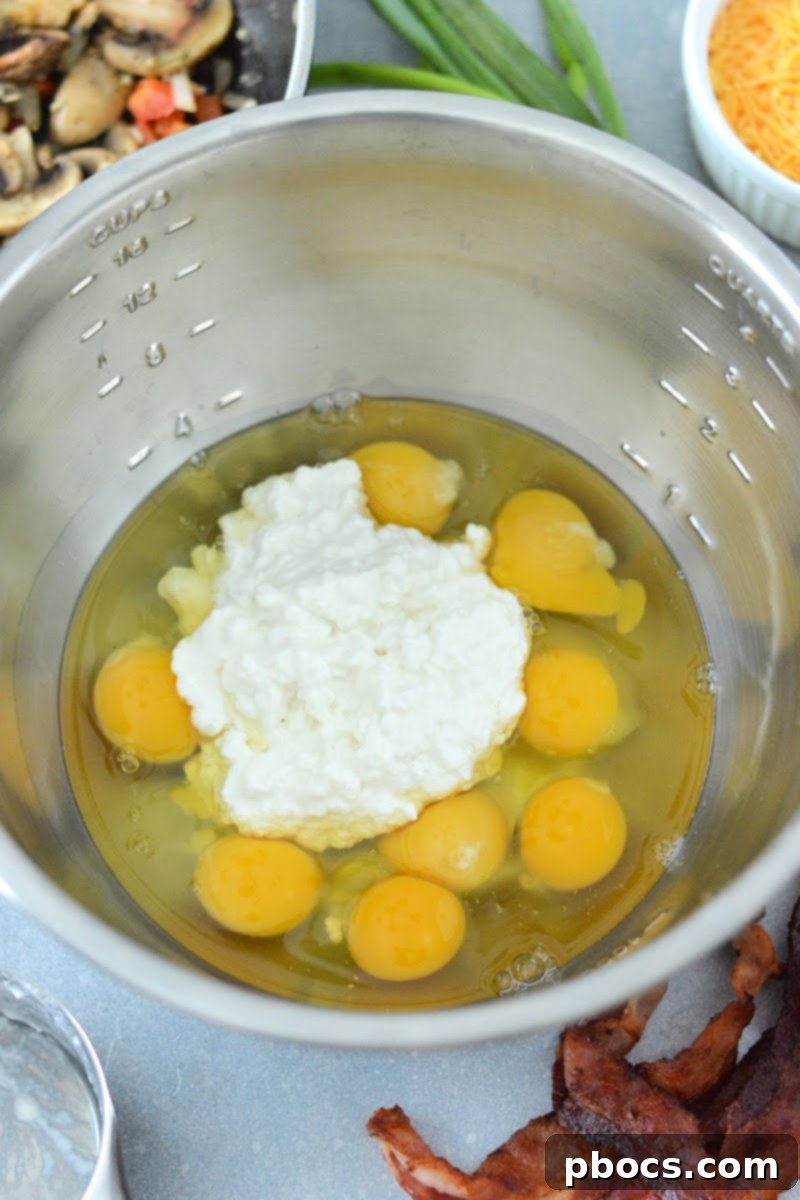 Adding cottage cheese and eggs to a mixing bowl.