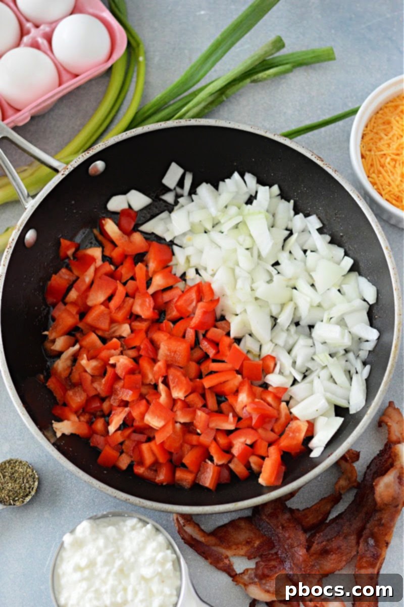 Chopped bell pepper and onion in a skillet