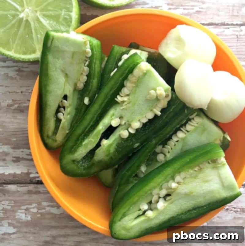 All Cilantro Jalapeño Sauce ingredients loaded into a food processor, ready for blending.