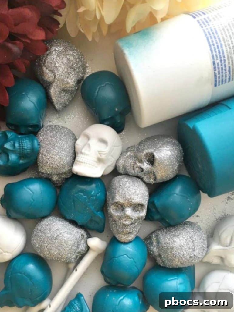 A skull being spray painted with aqua color, showing the transformation from dull to vibrant.