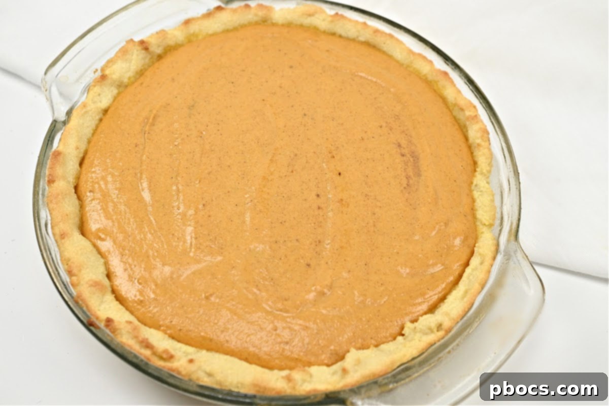 Costco Keto Pumpkin Pie Indulgence 13 Keto Costco Pumpkin Pie filling poured into crust
